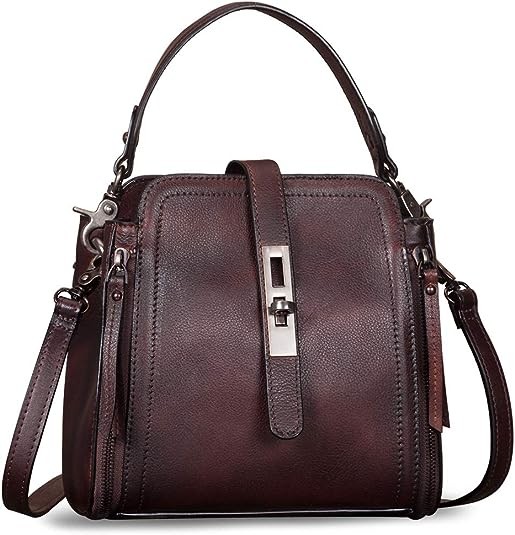 Imported Core sole Staples by The Drop 11.75” H x 5.75” L x 3” D This bag has a 3.5" strap drop Smooth faux leather Ruched handle Polyester lining